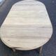 Round extendable dining table with flaps, stripped in raw oak, with 3 extensions.