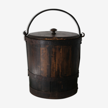 Old grain bucket in oak wrought iron strapping