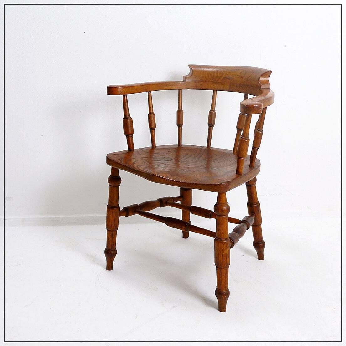 Elm armchair with curved back