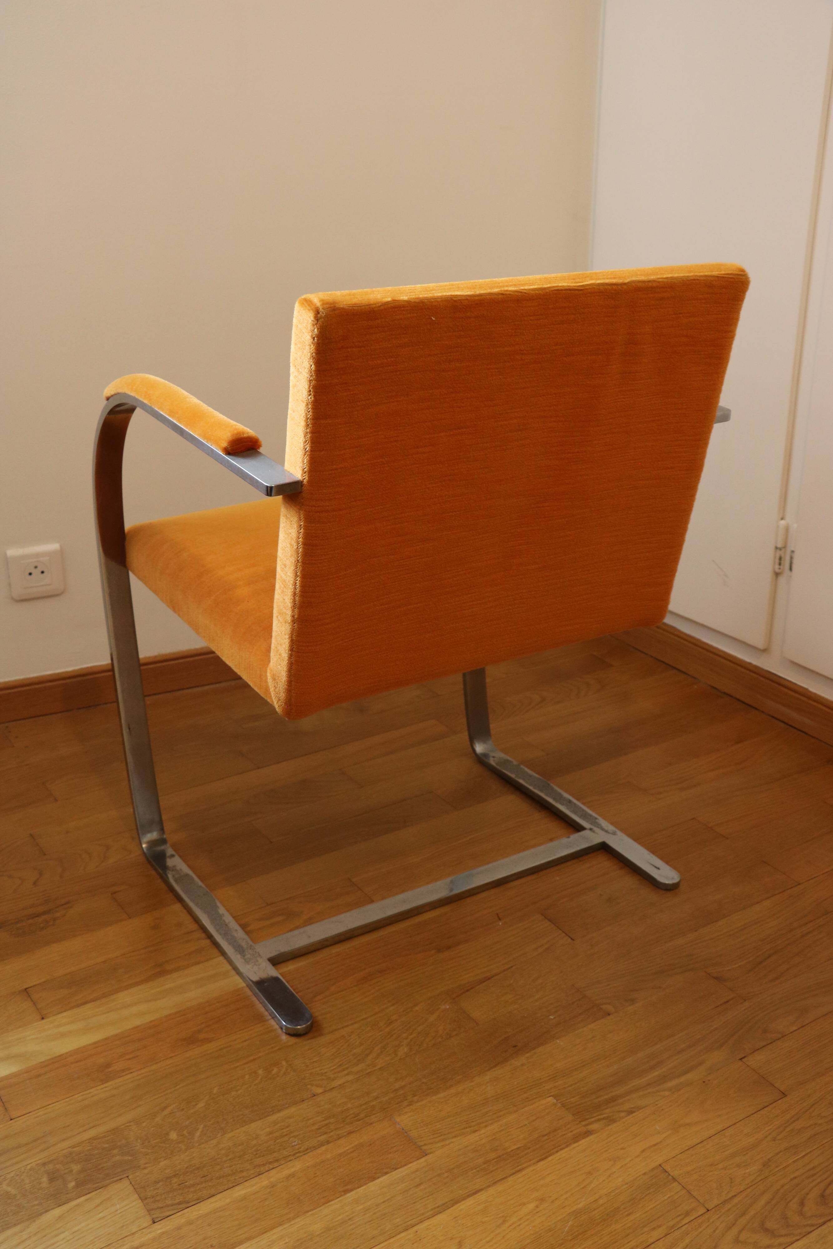 Chrome-plated metal and orange fabric armchair, 1970