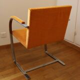 Chrome-plated metal and orange fabric armchair, 1970