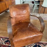 Vintage leather club chair with wooden armrests