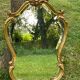 Beveled gilded wood mirror with violin shapes, Louis XV baroque style shell