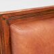 Pair of Art Deco armchairs in brown leather and teak, Netherlands, 1970s.