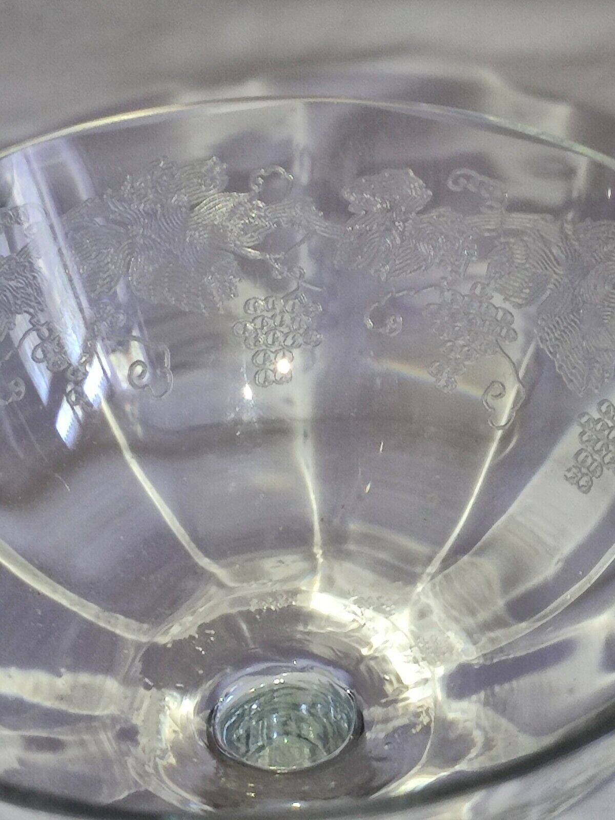 Beautiful set of seven crystal champagne glasses engraved with vine branches