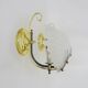Pair of shell wall lights in glass and gold-plated metal. 1980s