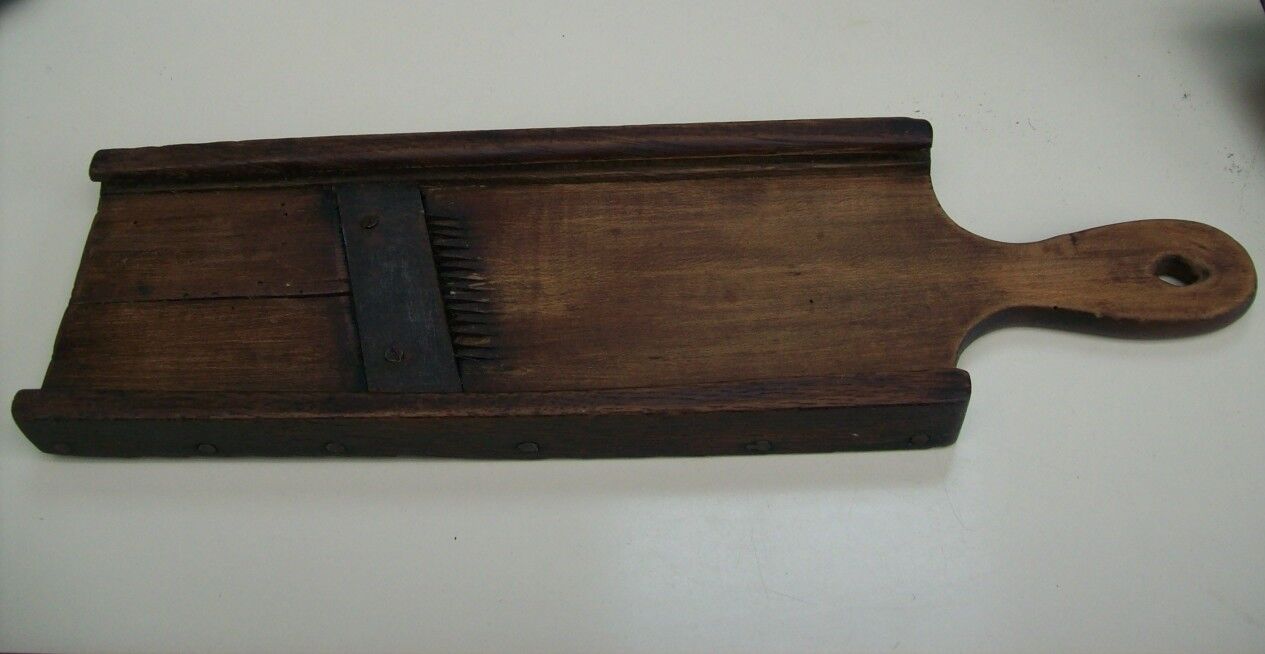 Old kitchen mandolin in wood and iron double blades