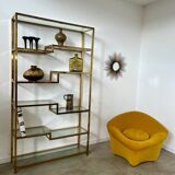 Old shelf in golden metal brass geometric library design 80s vintage