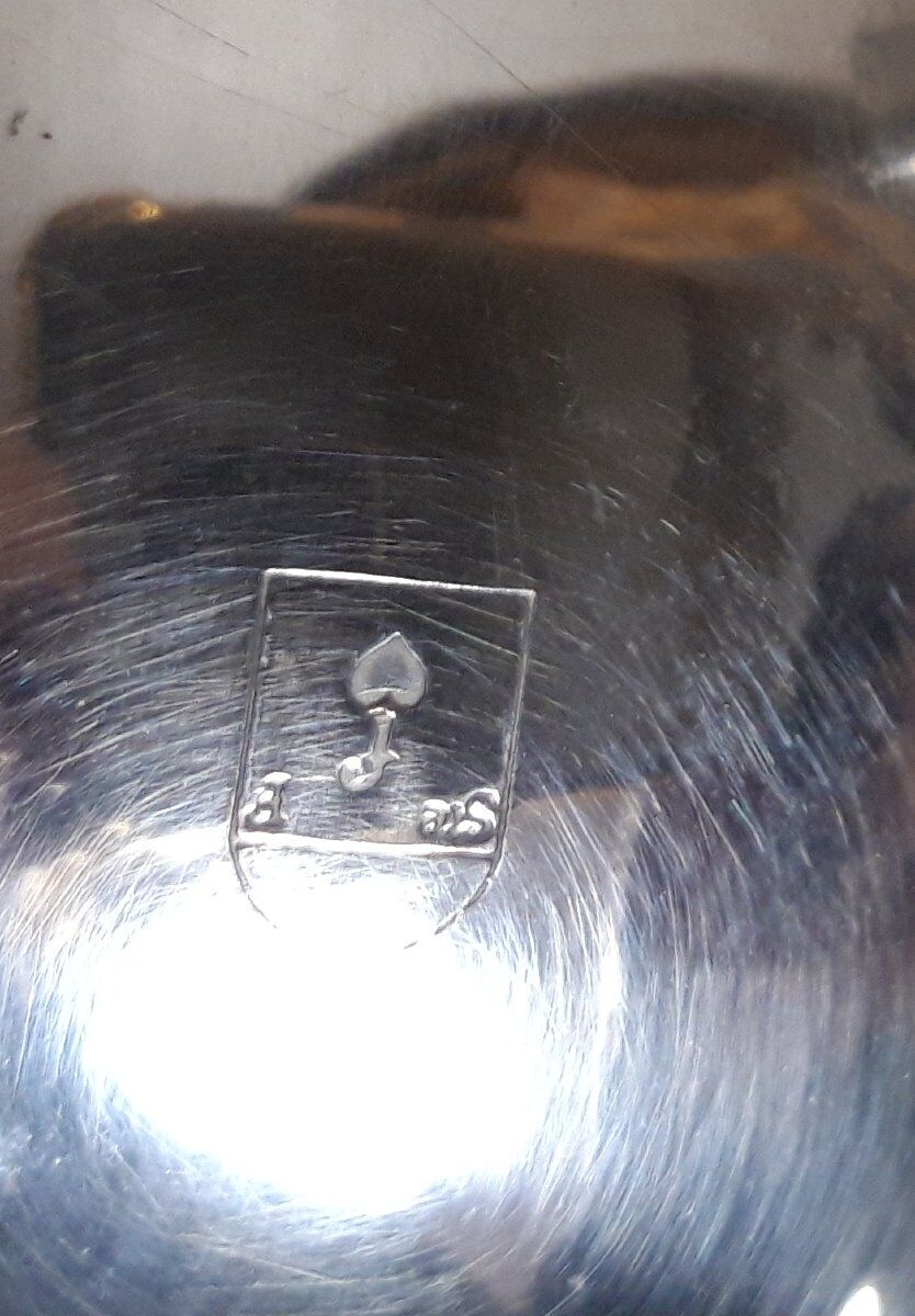 Silver-plated coffee and tea service including a coffee pot, a teapot, and a sugar bowl.