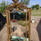 Large closed mirror, 19th century, wood and gilded stucco.