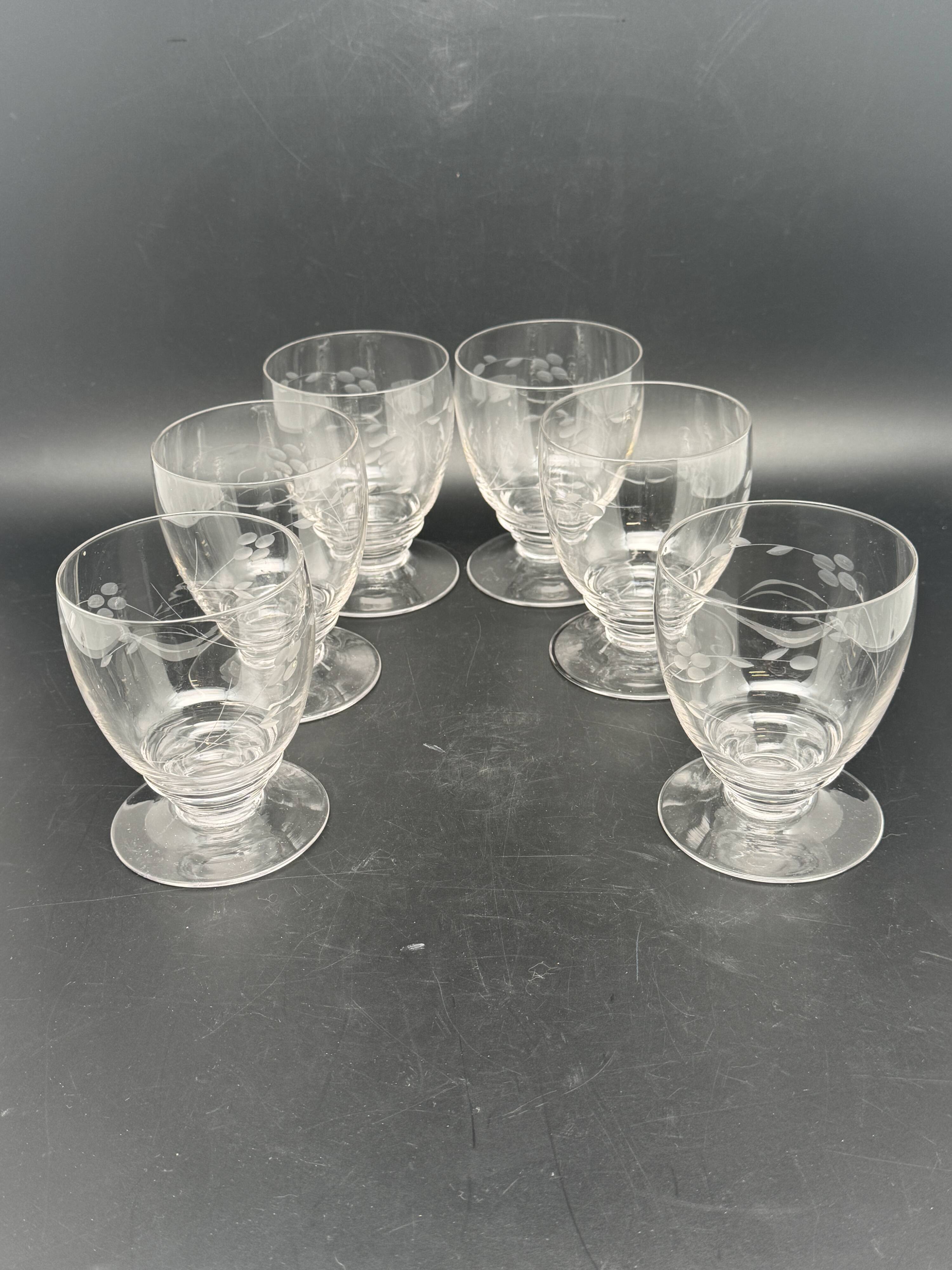 Set of fine glass stemmed glasses with small flower patterns