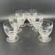 Set of fine glass stemmed glasses with small flower patterns