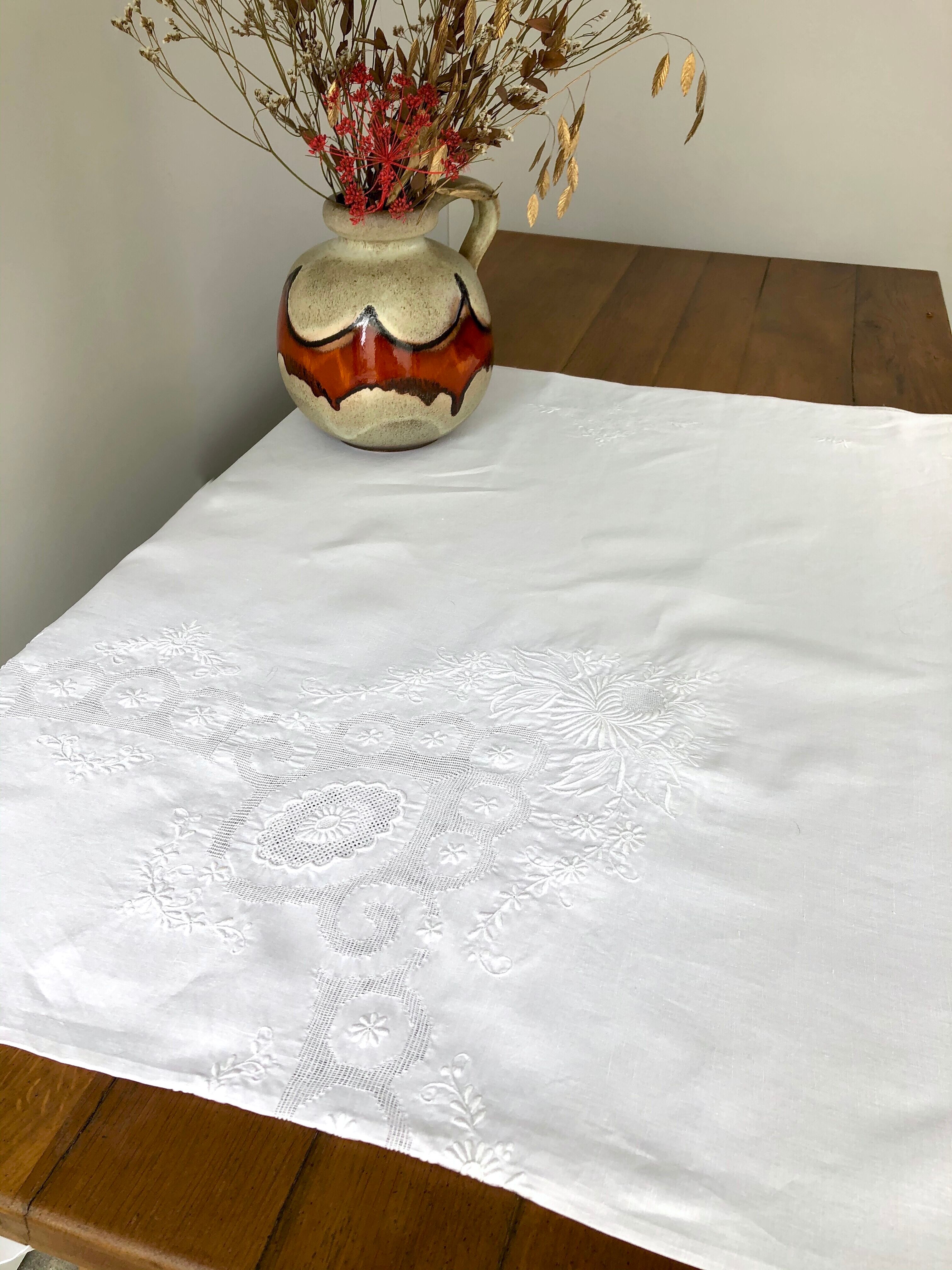 White coat embroidered floral patterns