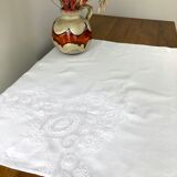White coat embroidered floral patterns