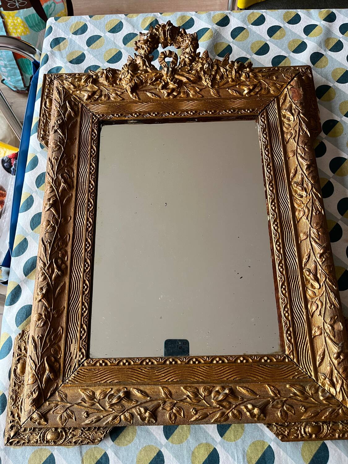 Golden trumeau mirror for fireplace, late 19th century, with sculpted pediment.