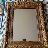 Golden trumeau mirror for fireplace, late 19th century, with sculpted pediment.