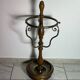 Umbrella stand and English-style wooden and brass canes, 20th century.