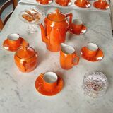 Iridescent orange porcelain coffee set from the 50s-60s with black edging