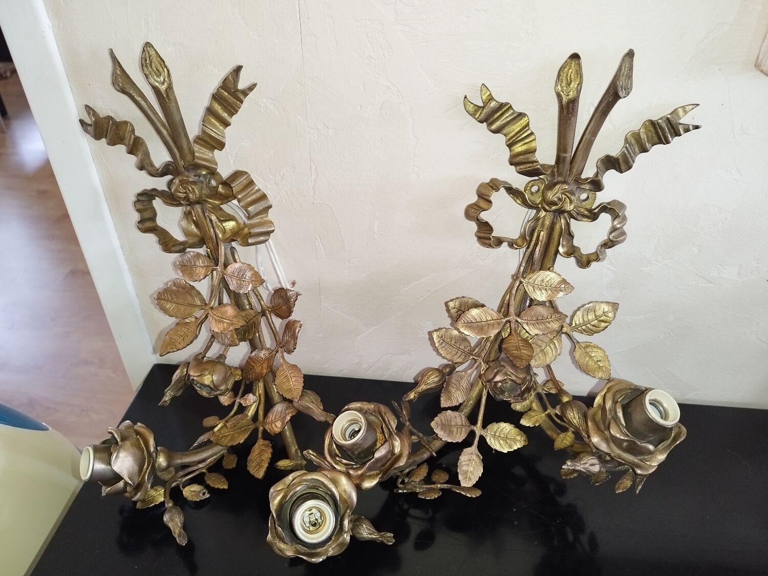 Pair of bronze and gilded metal wall sconces in the Louis XVI style.
