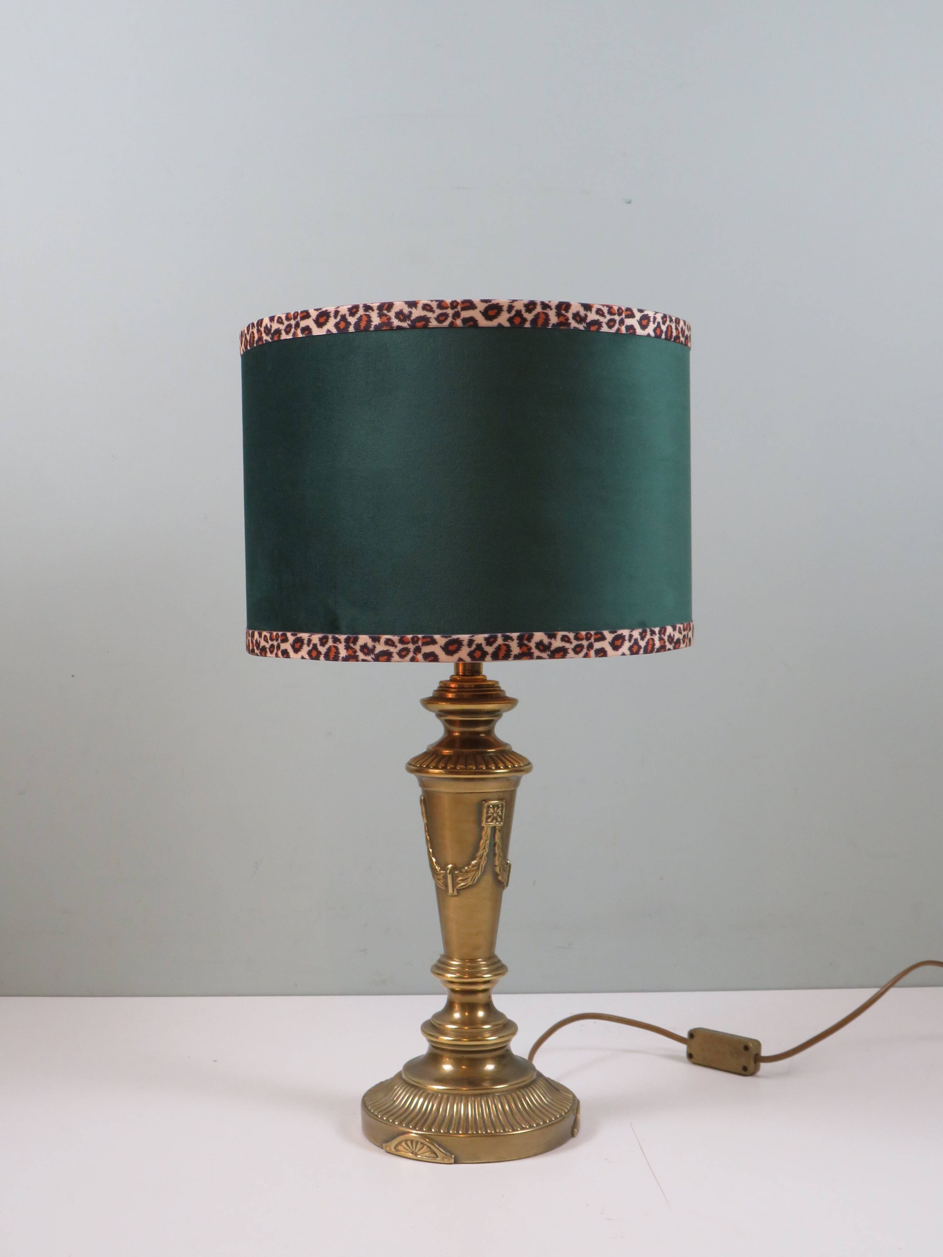 Vintage brass table lamp with green velvet shade.