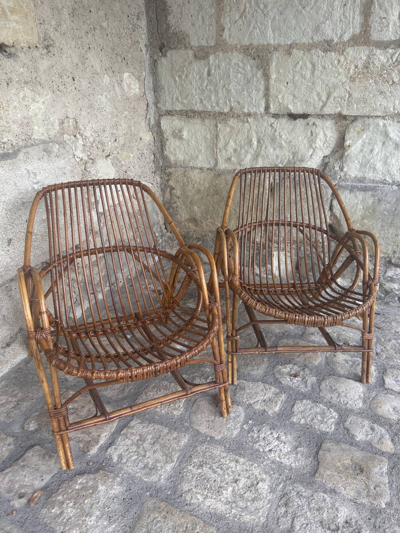 Pair of vintage rattan armchairs from the 1960s – a perfect timeless piece for indoors and outdoors.