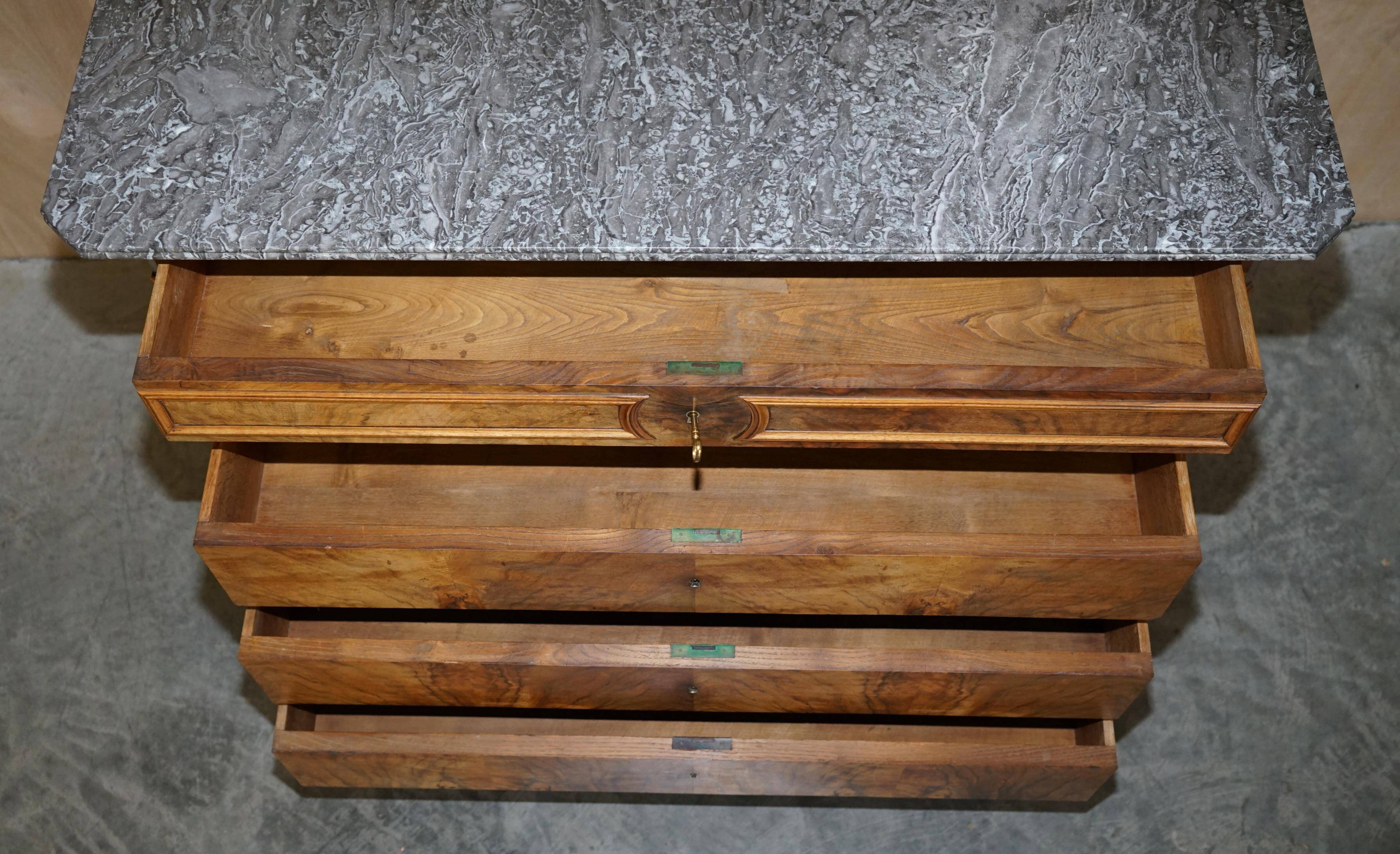 Antique walnut commode from 1860 with a marble top and original key.