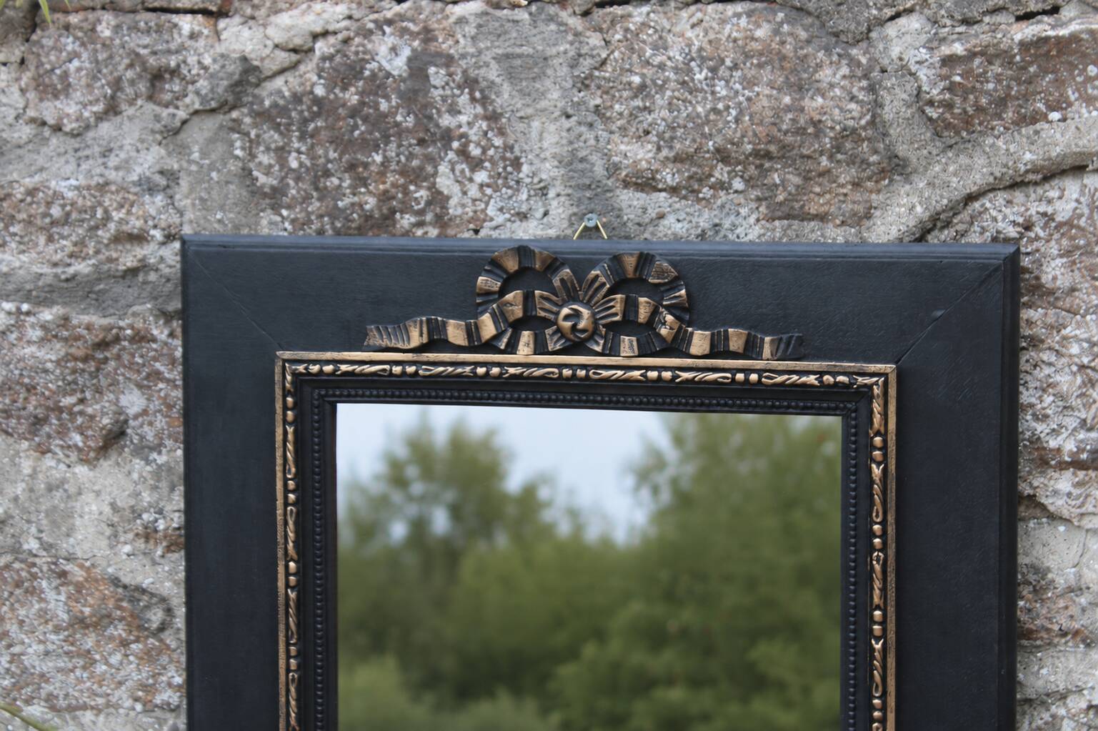 Vintage black and gold wooden mirror with a pediment – Napoléon III style
