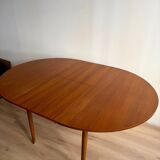 Vintage Scandinavian round table from the 50s and 60s in extendable teak with ra.
