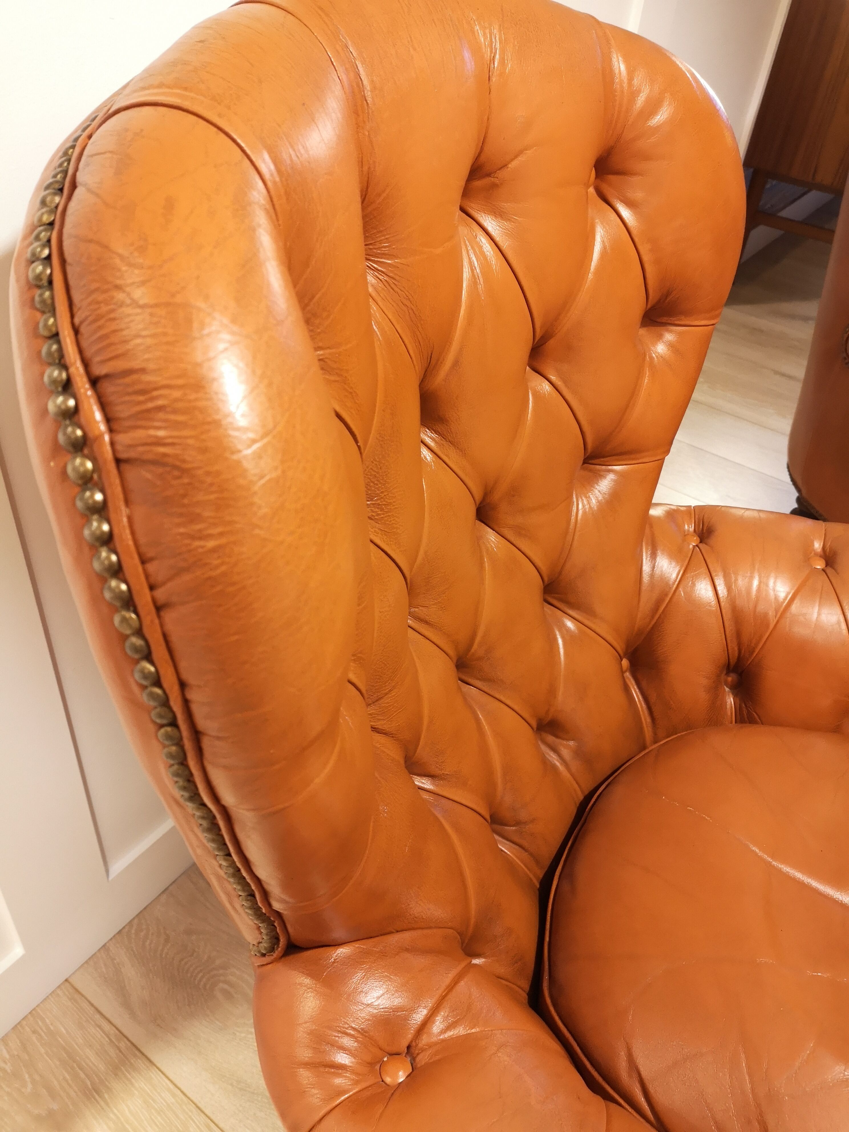 Pair of leather chesterfield chairs