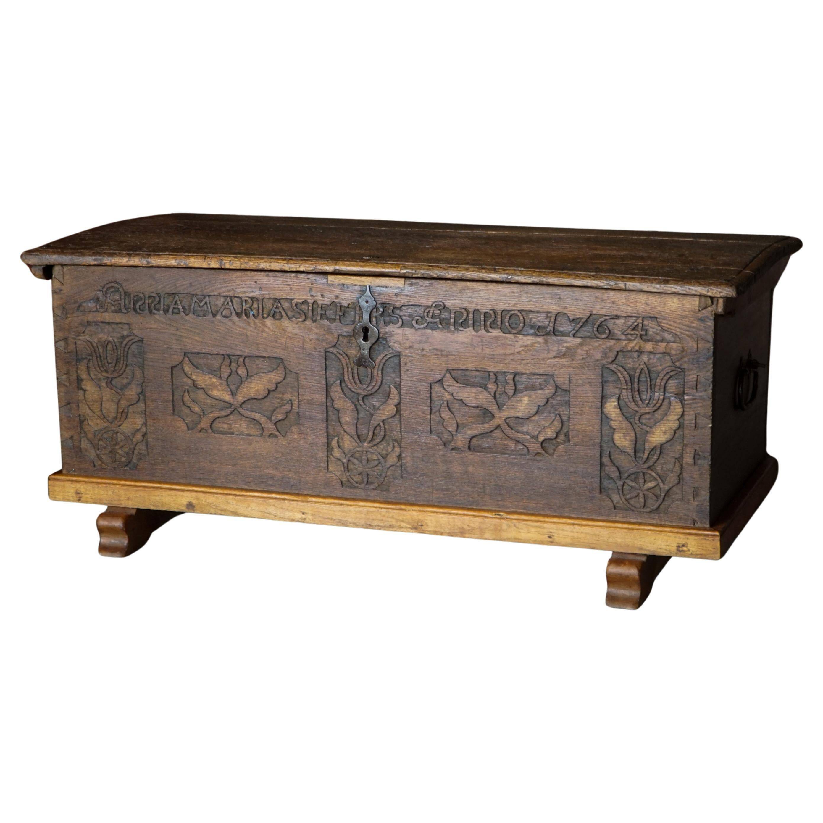 18th-century Scandinavian popular art oak chest with carved panels, dated 1764.