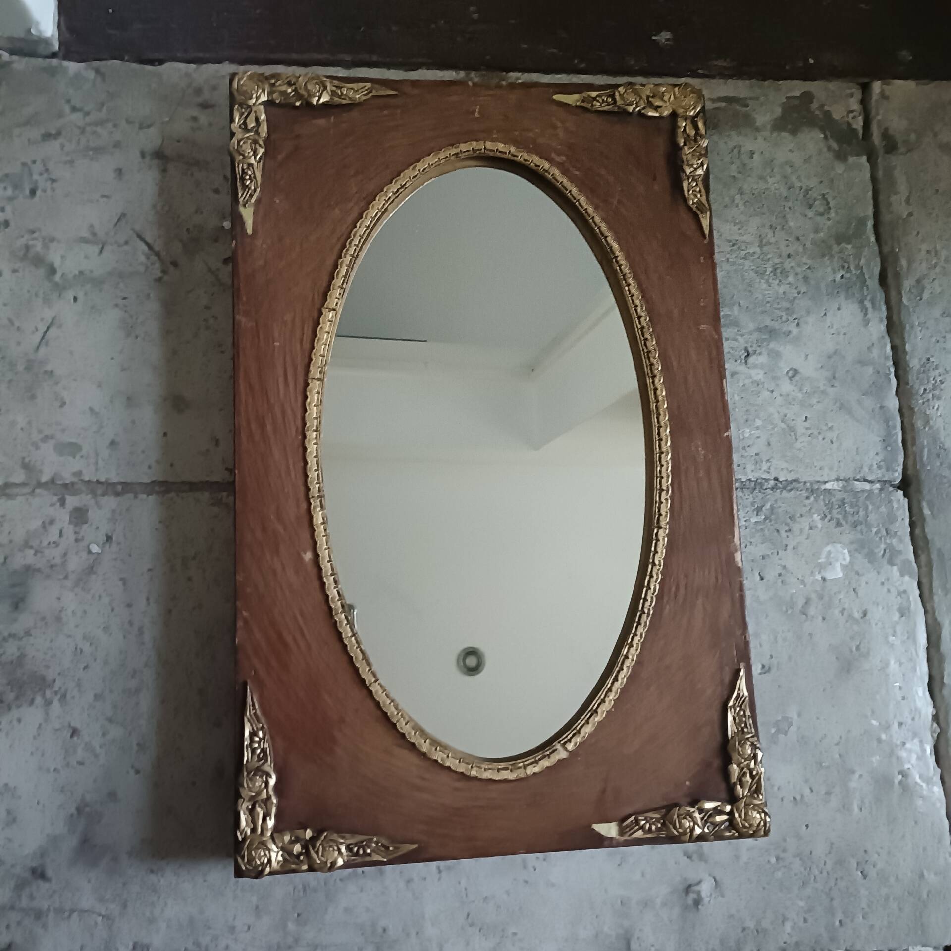 Oval and gold Art Deco mirror