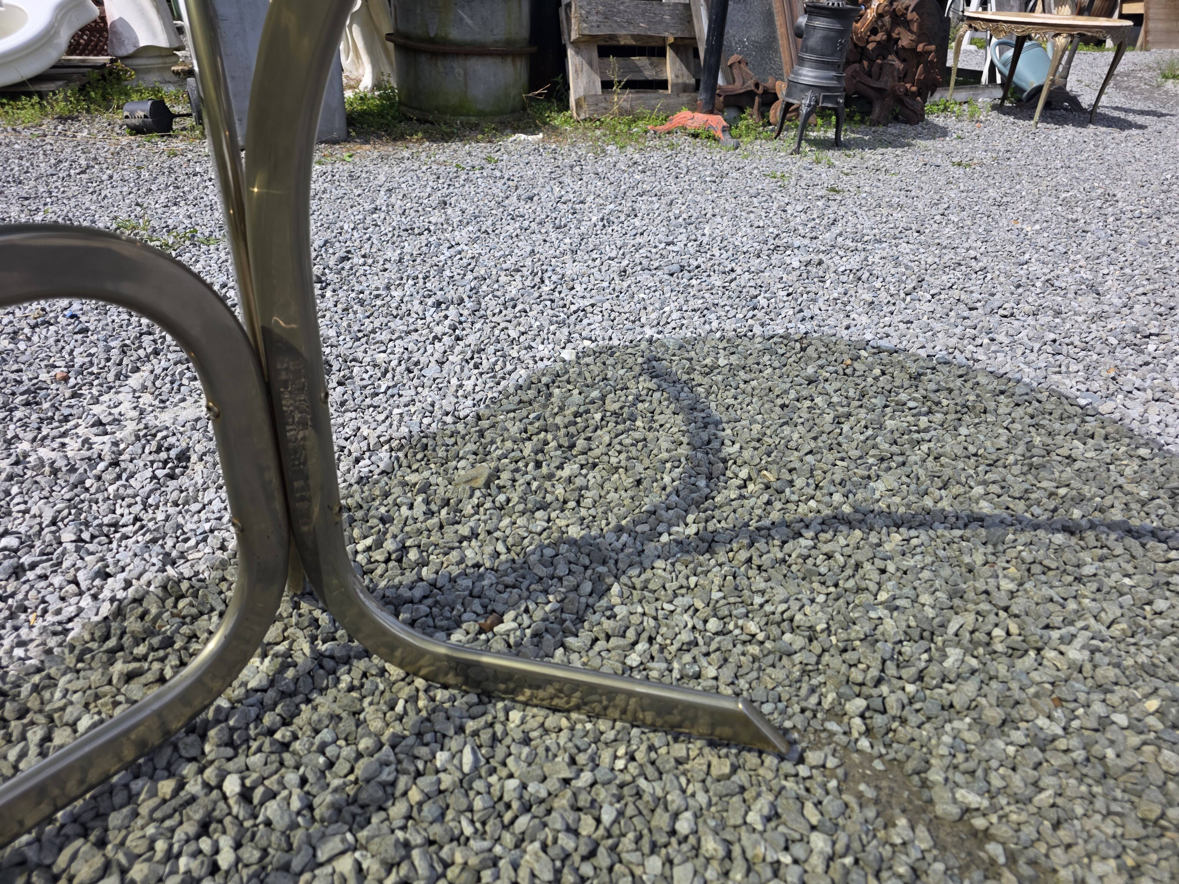Silver metal table with smoked glass top from the 1970s.