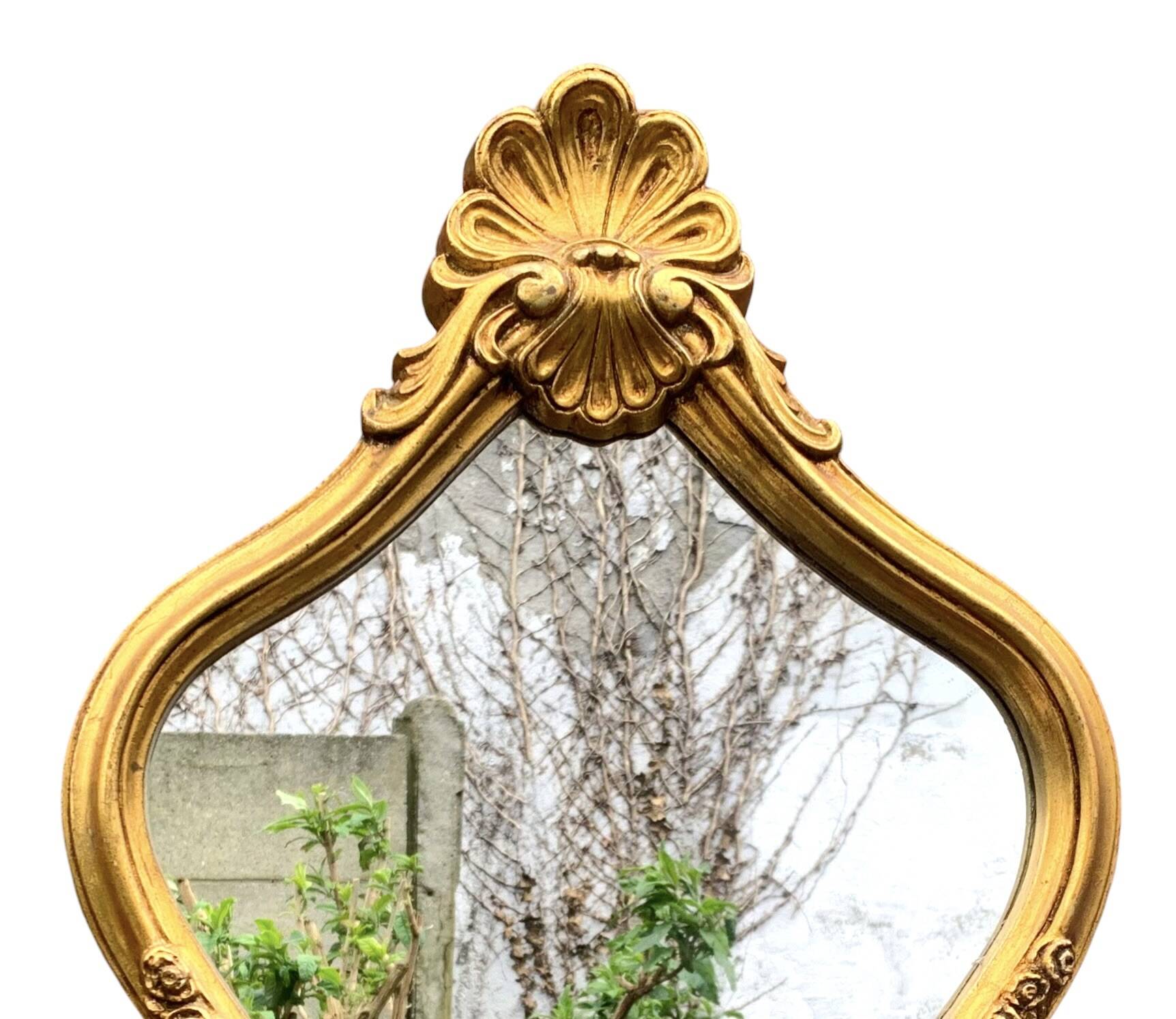 Large rococo mirror in gilded wood