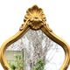 Grand miroir rococo en bois doré
