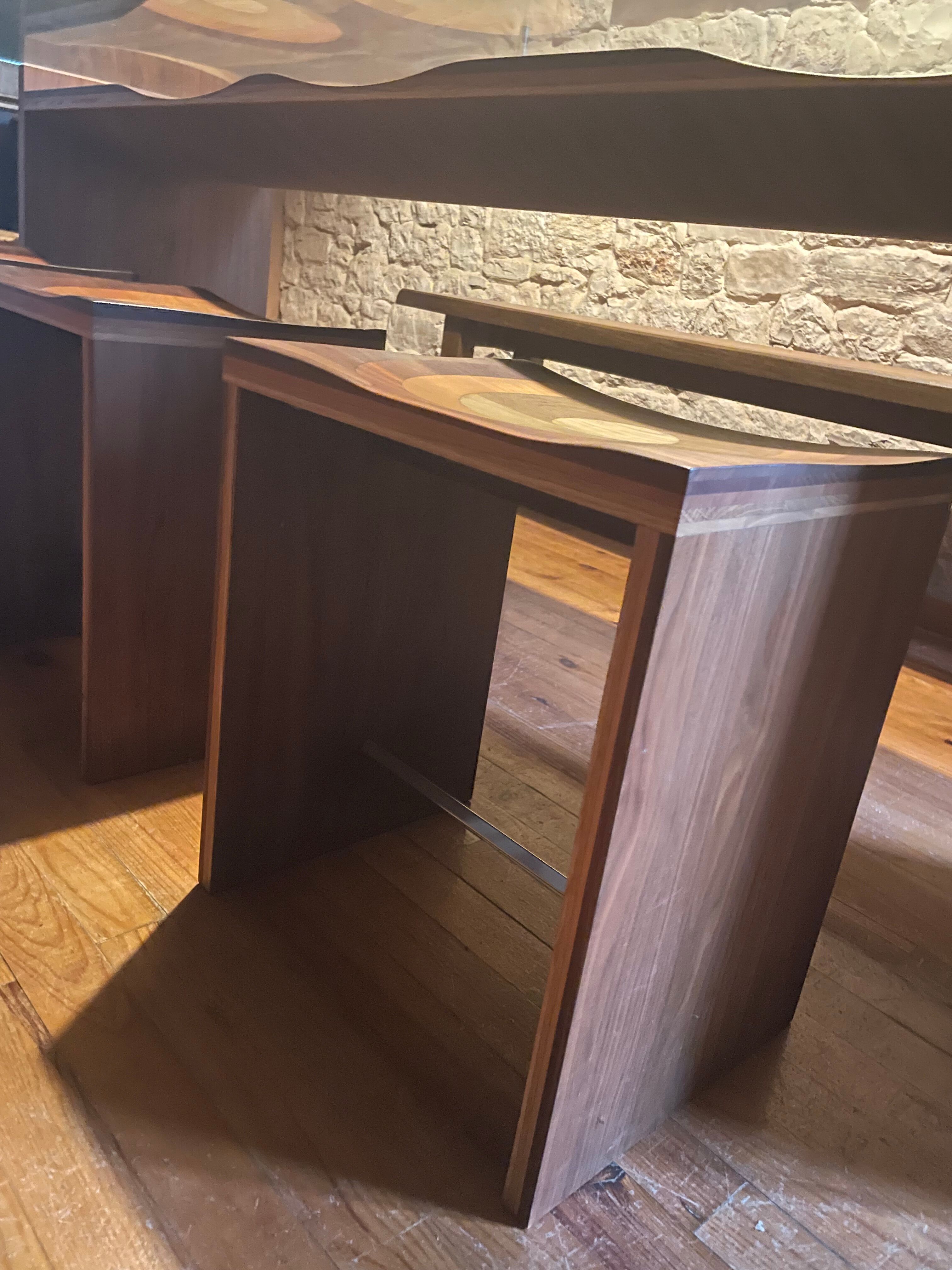 Dining table and 3 Ripples stools by Toyo Ito.