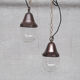 Pair of brass and clear glass industrial pendants