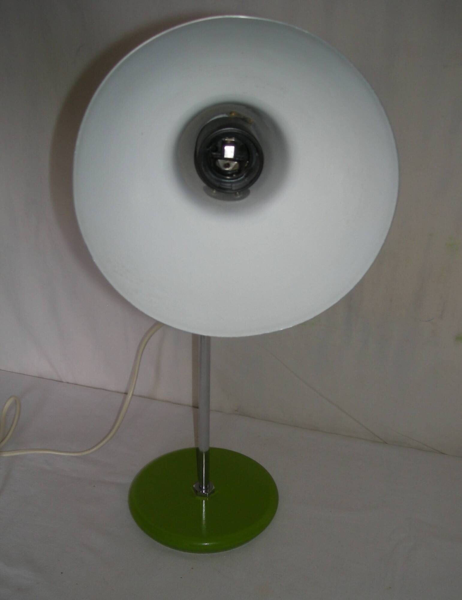 Green desk lamp with an arm from the 1970s.