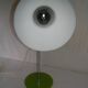 Green desk lamp with an arm from the 1970s.