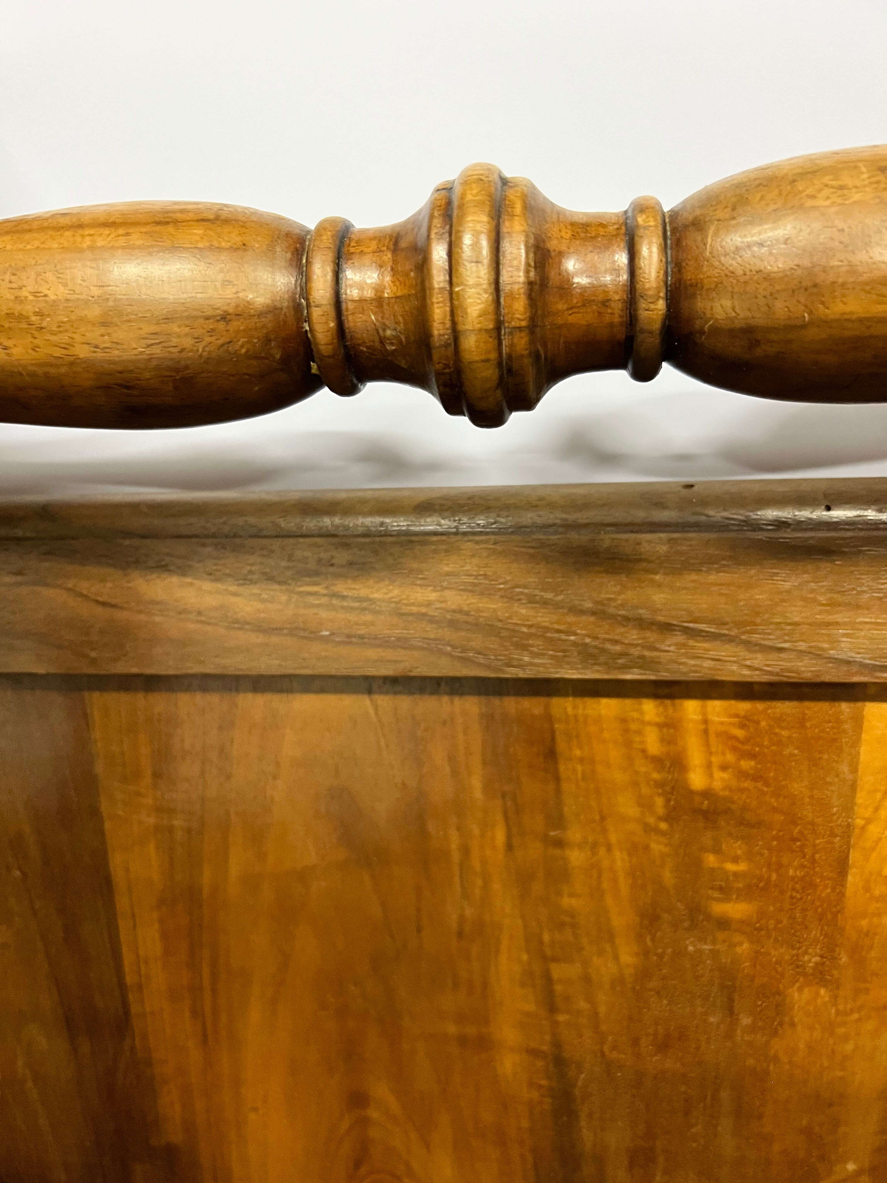 Old children's bed with retractable walnut bars