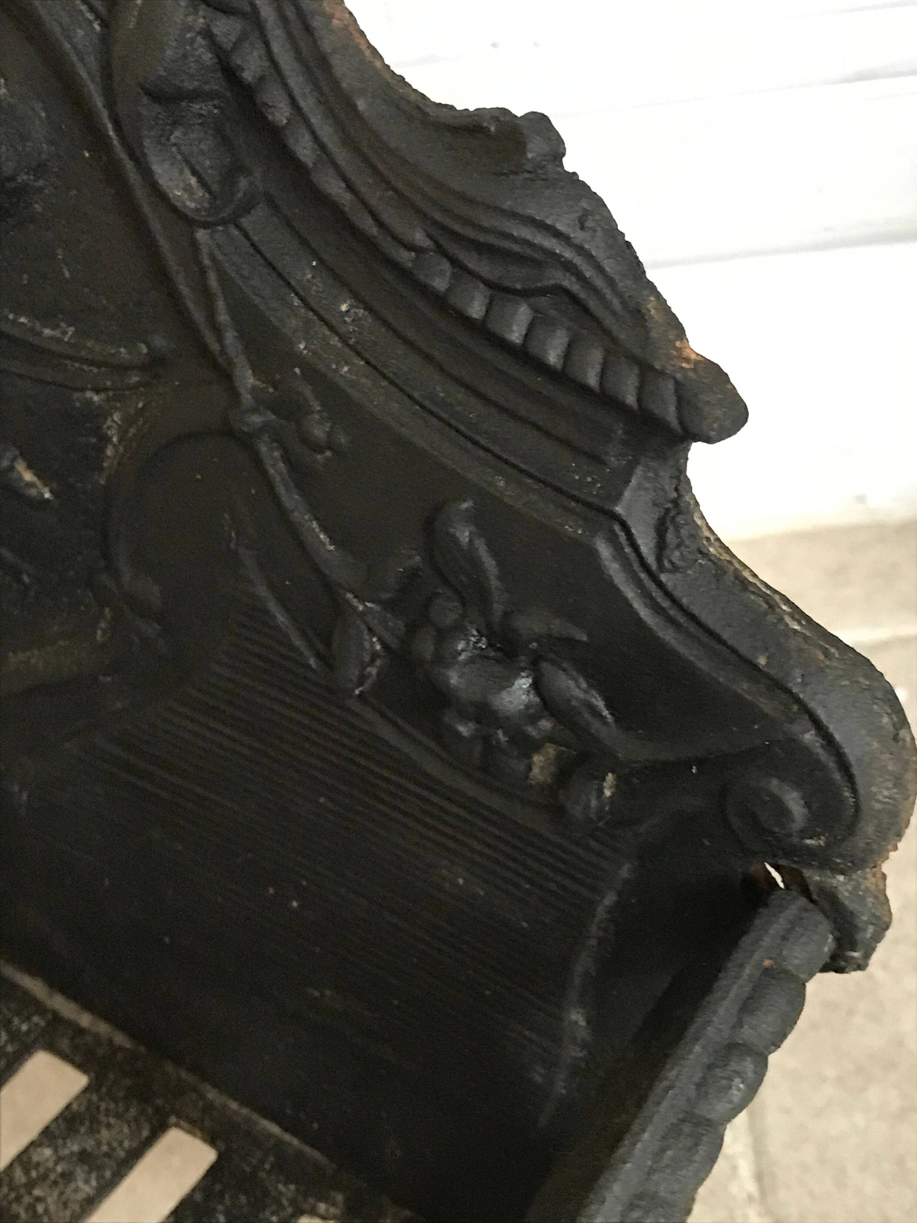 Cast iron fireplace cradle log holder