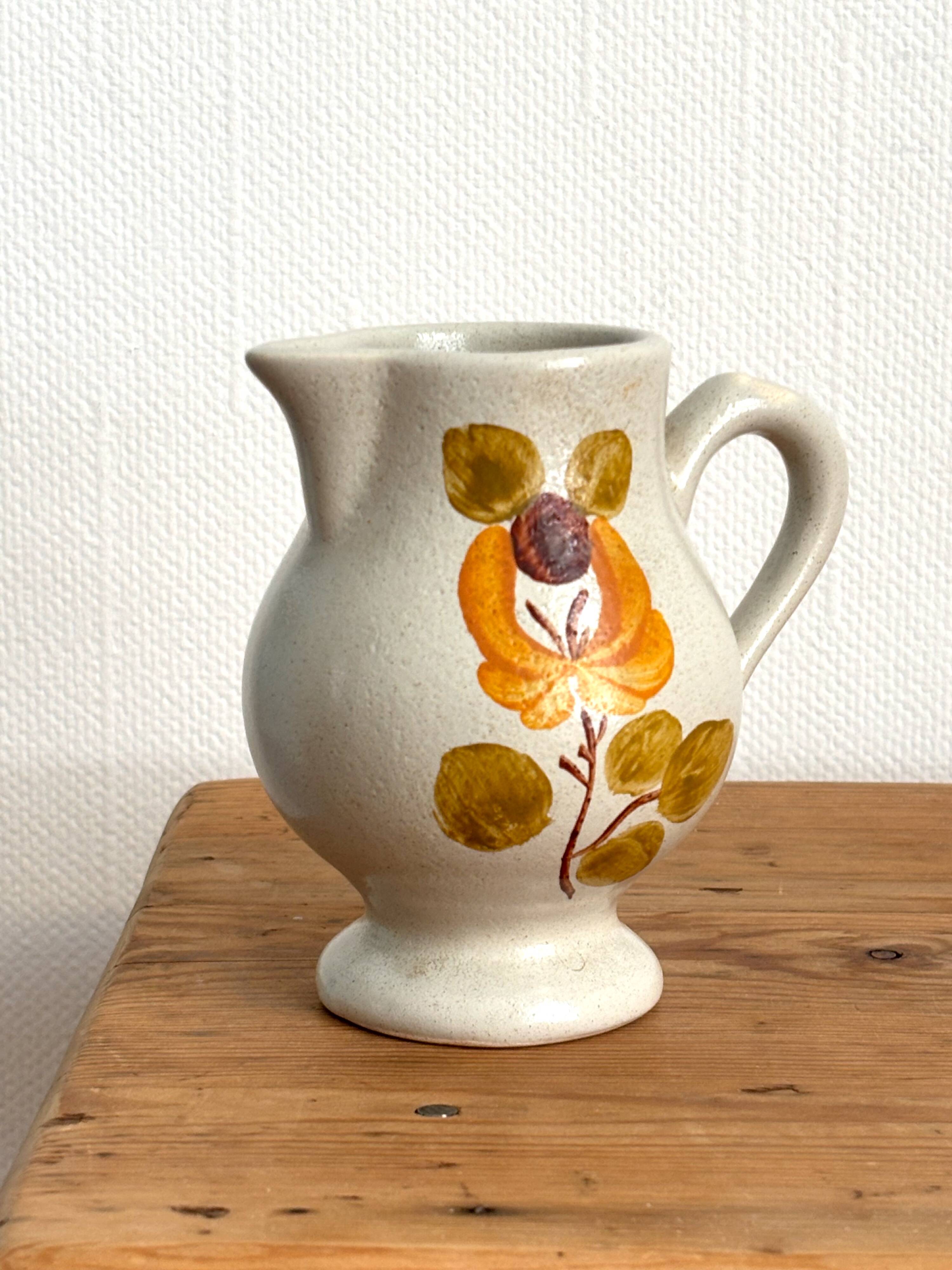 Vintage Maine St Amand earthenware pitcher with floral decorations
