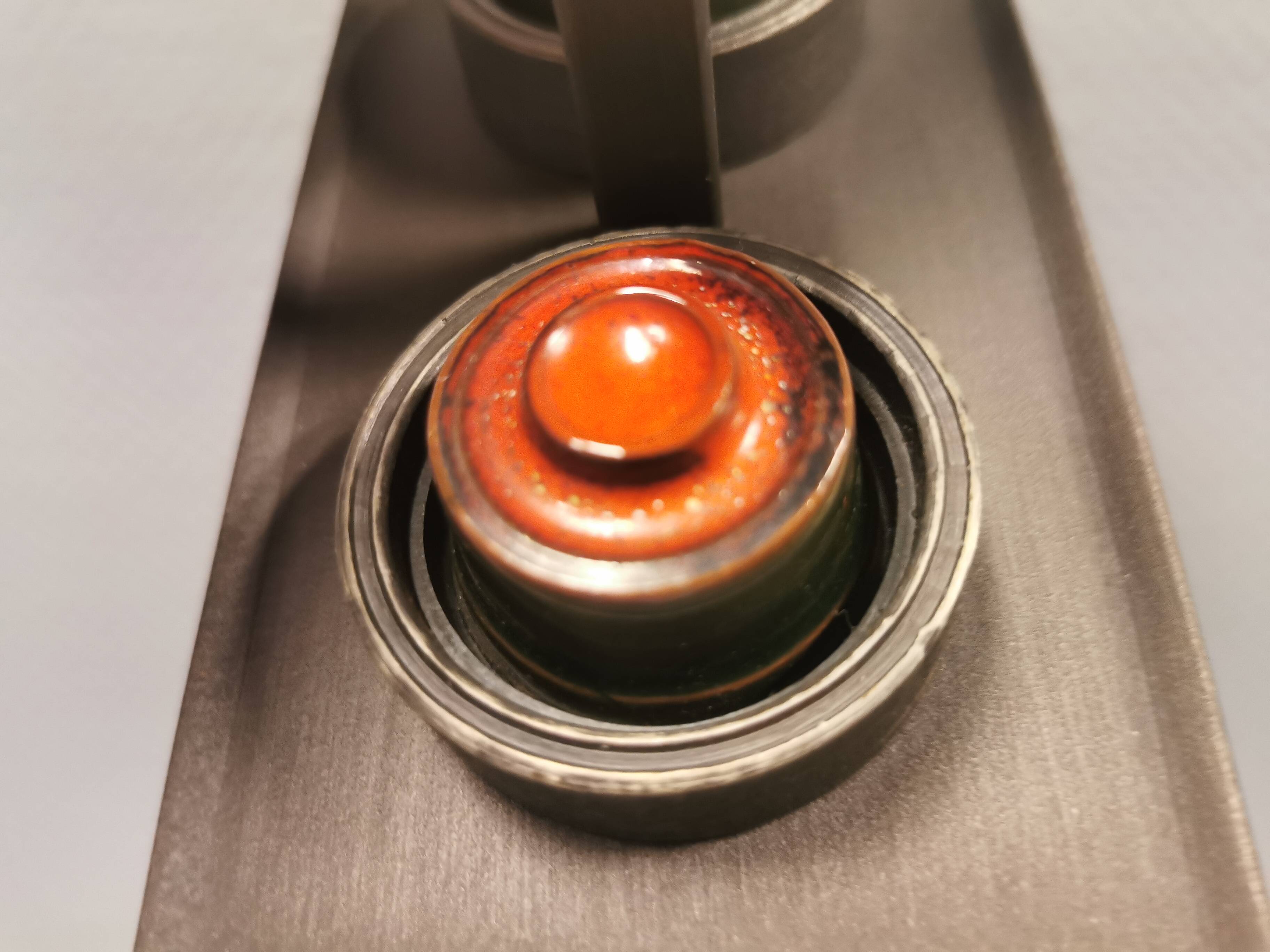 A set of Vitrika Denmark, cast iron wall lights with red details.