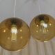 Pair of vintage smoked glass ball pendant lights from Biot glassworks