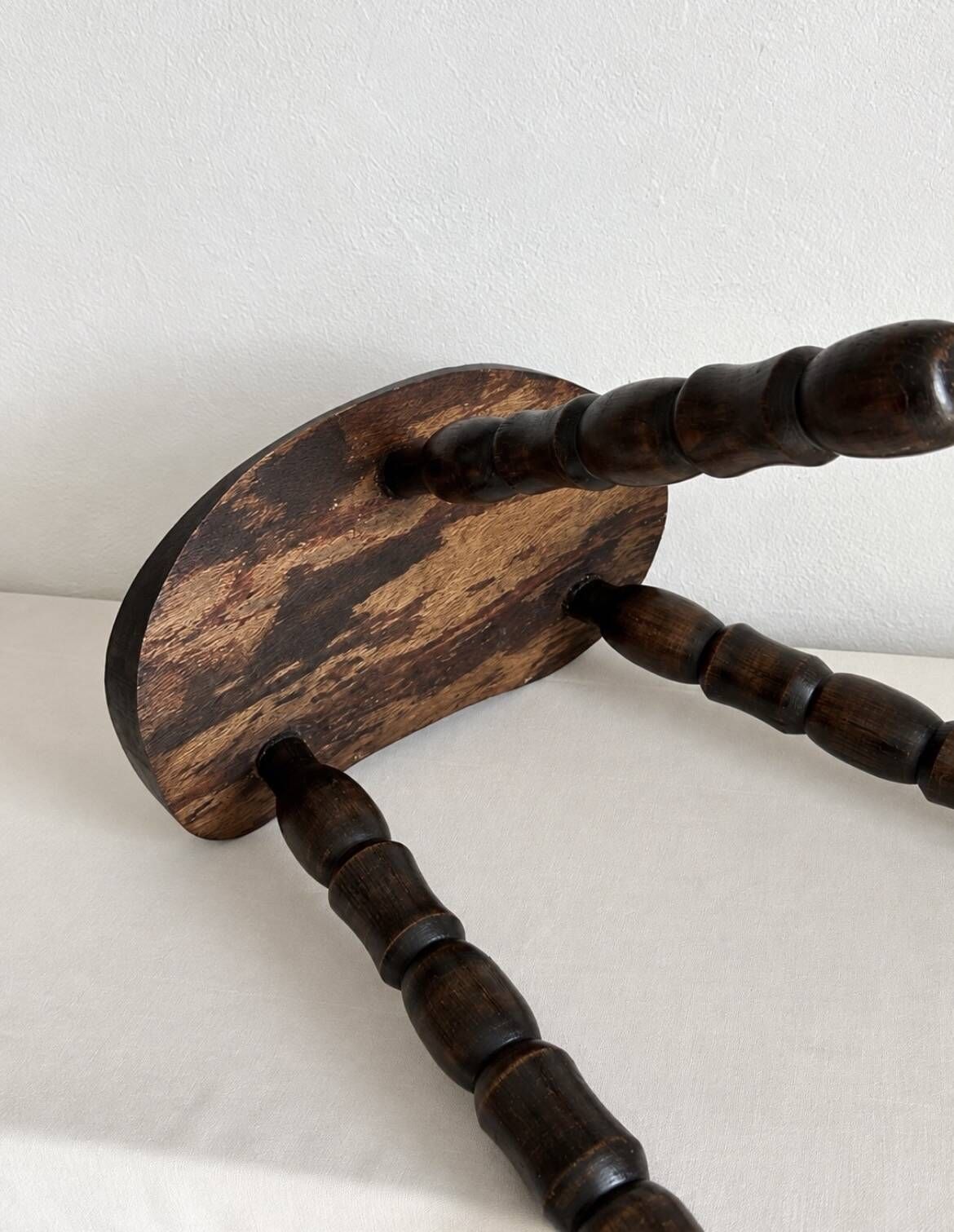 Restored dark wood tripod stool, bobbin leg, elegant furniture.