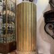 Large fluted golden wood column with a marble top, work from around 1900.