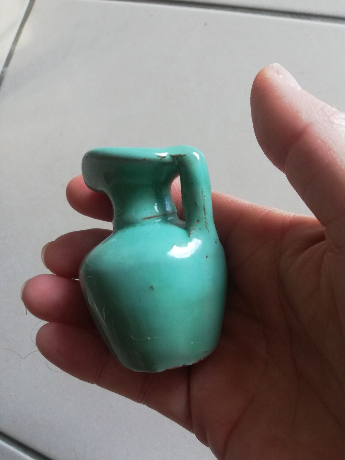 Very small turquoise soliflore in the shape of a ceramic jug