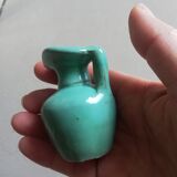 Very small turquoise soliflore in the shape of a ceramic jug