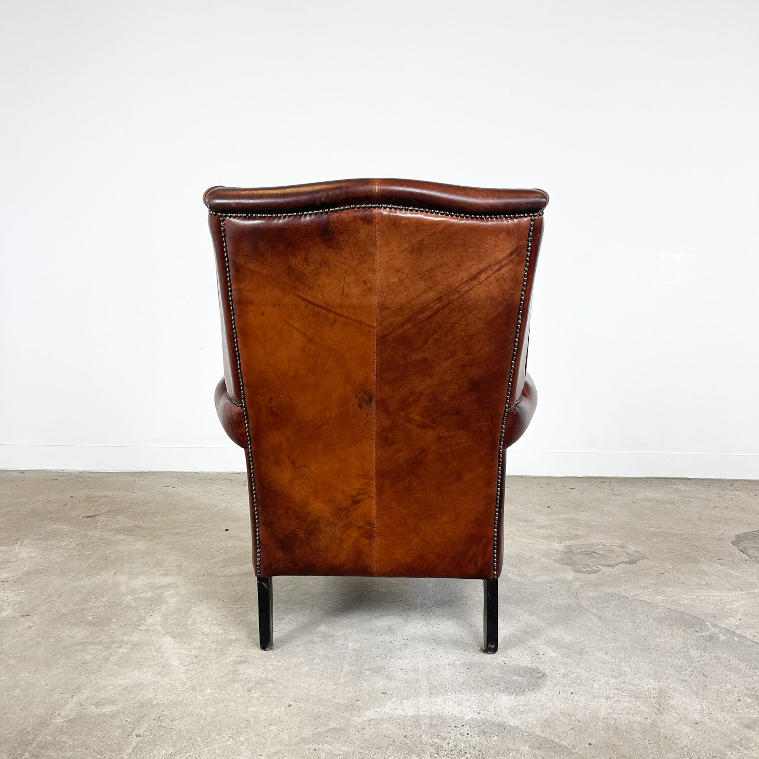 Vintage sheep leather wingback armchair Goor