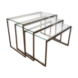 Modernist work, suite of three trundle tables in chromed metal and glass