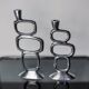 Pair of circle candlesticks by Matthew Hilton, England, 1980